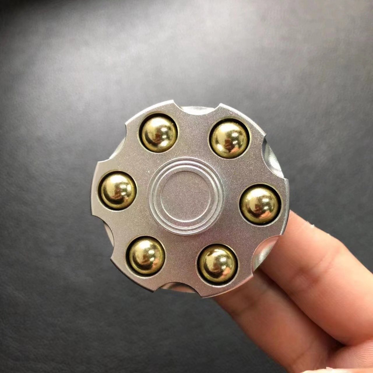 cbb242e2-d665-45d1-b9a6-36ba4b9bf375.jpg Unique Brass Gun Revolver Bullet Fidget Toy Spinner Copper Hand Spinners Detachable Rotating Sensory Finger Top For Kids Adults - Image 9
